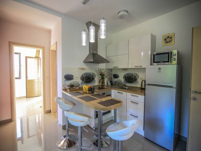 Apartment Apartment in Pridvorje near Pasjaca Beach - Features photo 13