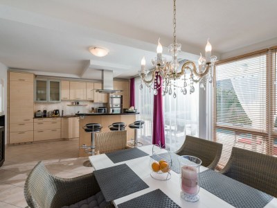 Holiday house Holiday flat in the centre of Söll with pool - Features photo 12