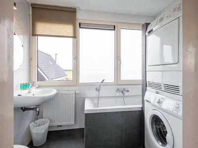 Holiday house Holiday home near dunes with wellness garden - Features photo 21