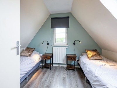 Holiday house Holiday home near dunes with wellness garden - Features photo 26