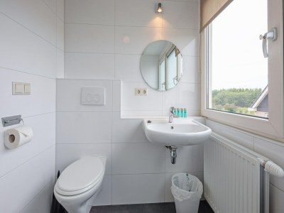 Holiday house Holiday home near dunes with wellness garden - Features photo 31