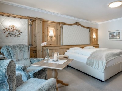 Holiday room DOPPELZIMMER DE LUXE mit Halbpension - Features photo 24