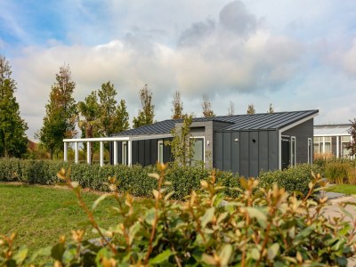 Holiday park Holiday Home in Zeeland with Streamside Terrace - Outdoor photo 2