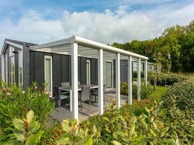 Holiday park Holiday Home in Zeeland with Streamside Terrace - Outdoor photo 5