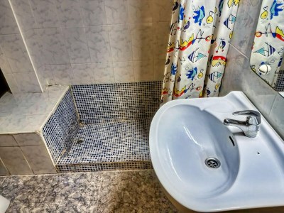 Apartment Apartment near Beach with Serene Garden - Features photo 22