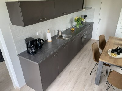 Holiday house Cosy holiday home with large garden - Features photo 12