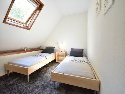 Holiday house Cosy holiday home with large garden - Features photo 18