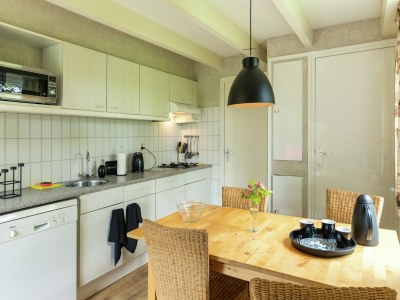 Holiday house Cosy holiday home with large garden - Features photo 24