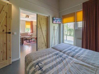 Holiday park Holiday Home in Zeeland with Spacious Garden - Features photo 19