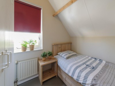 Holiday park Holiday Home in Zeeland with Spacious Garden - Features photo 23