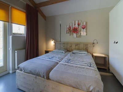 Holiday park Holiday Home in Zeeland with Spacious Garden - Features photo 24