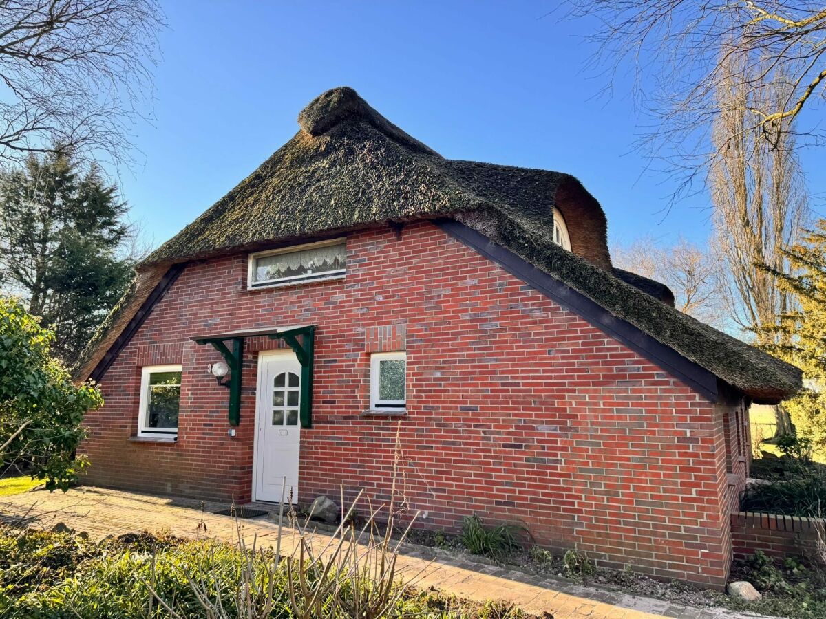 Apartment Ferienwohnung im Reetdachhaus, Burhave