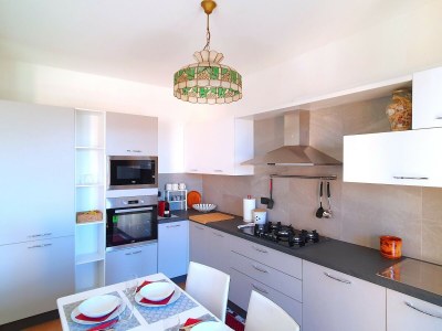 Holiday house House in Luino with Green Garden and City Views - Features photo 21