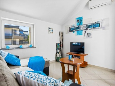 Apartment Familienfreundliches Apartment mit Meerblick - Features photo 14