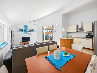 Apartment Familienfreundliches Apartment mit Meerblick - Features photo 15