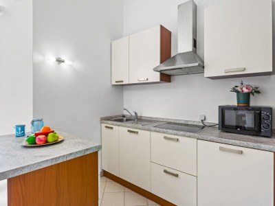 Apartment Familienfreundliches Apartment mit Meerblick - Features photo 17