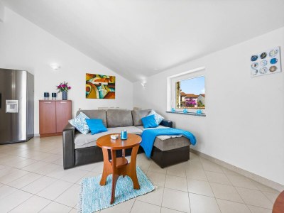 Apartment Familienfreundliches Apartment mit Meerblick - Features photo 19