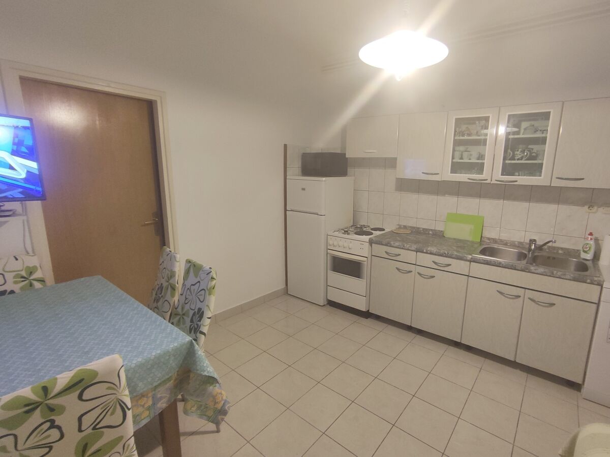 Apartment Two bedroom apartment with terrace and sea view Banjol, Rab A-23095-a - Outdoor photo 5