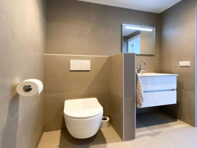 Holiday house Modern & cozy holiday home near beach - Features photo 12