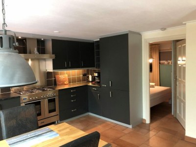 Holiday house Furnished bungalow with garden - Features photo 11