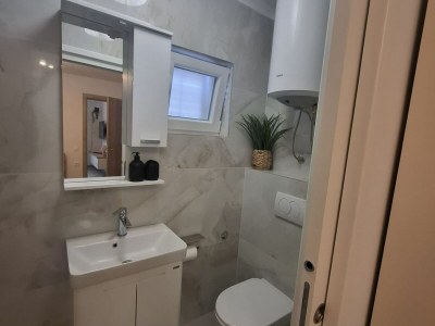 Apartment Apartment Jakić - One Bedroom Apartment with Garden View - Features photo 14