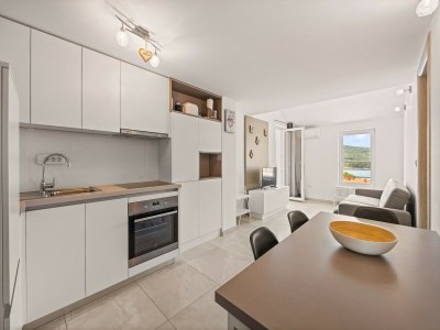 Apartment Bezauberndes Sommerapartment mit Meerblick - Features photo 13