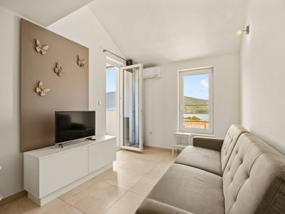 Apartment Bezauberndes Sommerapartment mit Meerblick - Features photo 20