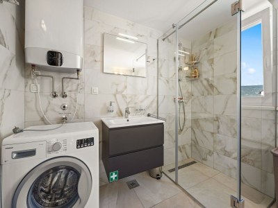 Apartment Bezauberndes Sommerapartment mit Meerblick - Features photo 22