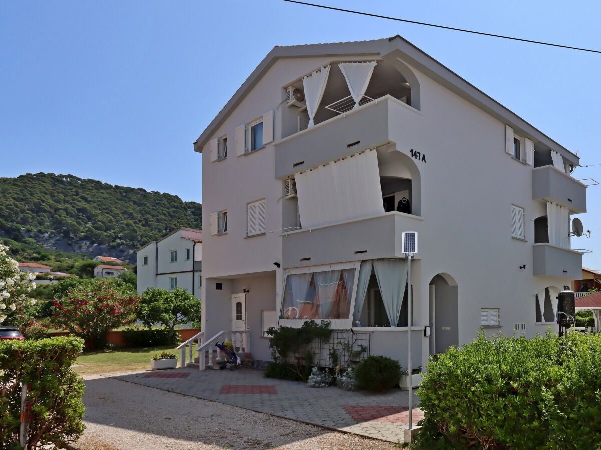 Apartment Two bedroom apartment with balcony Barbat, Rab A-24547-b - Outdoor photo 3