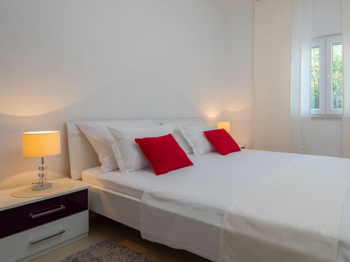 Apartment Two bedroom apartment with terrace and sea view Seget Vranjica, Trogir A-978-b