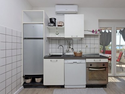 Apartment Two bedroom apartment with terrace and sea view Barbat, Rab A-14247-a - Outdoor photo 16