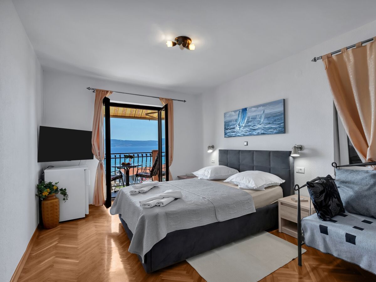 Holiday room with balcony and sea view Duće, Omiš S-10303-f