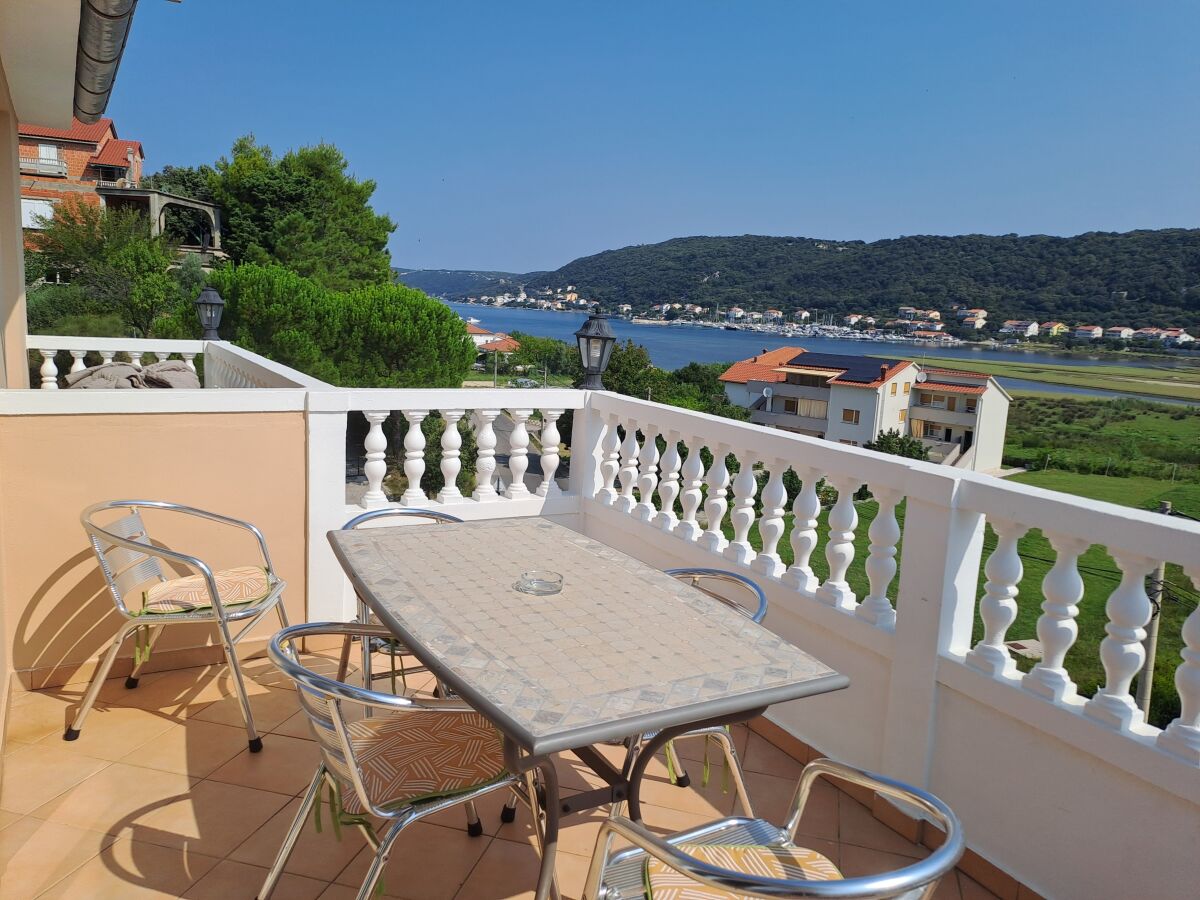 Apartment Two bedroom apartment with terrace and sea view Supetarska Draga - Donja, Rab A-14425-d