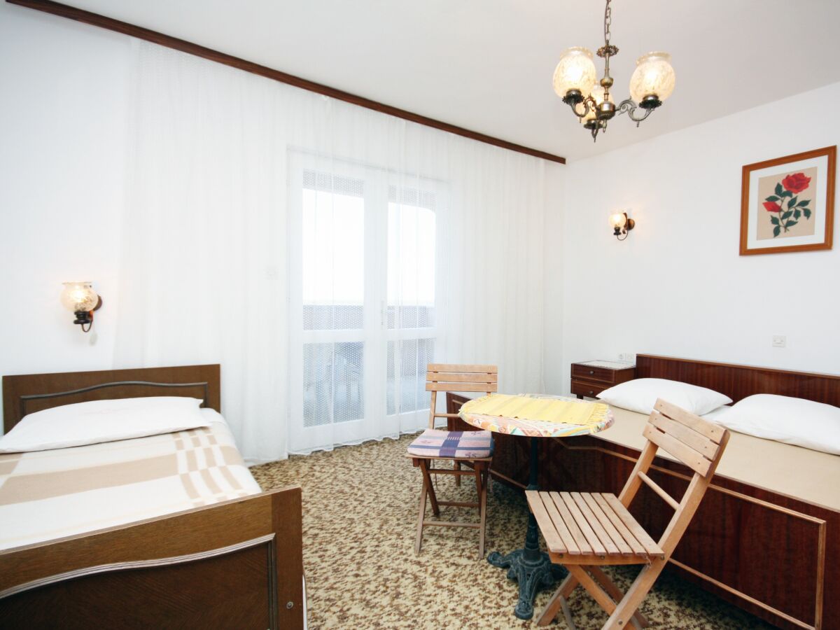 Holiday room with terrace and sea view Barbat, Rab S-5070-e