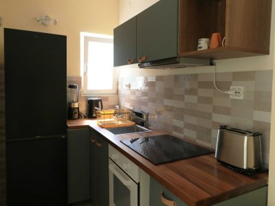 Holiday house Four Bedroom Holiday Home with Pool - Features photo 12