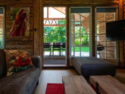 Holiday park Spacious wooden chalet with covered terrace - Features photo 16