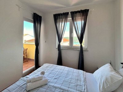 Apartment Two bedroom apartment with balcony and sea view Čižići, Krk A-22046-b in Dobrinj - Apartment