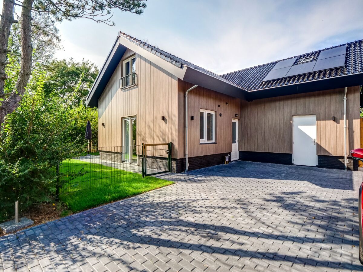 Holiday house Modern holiday home on Dutch coast with garden