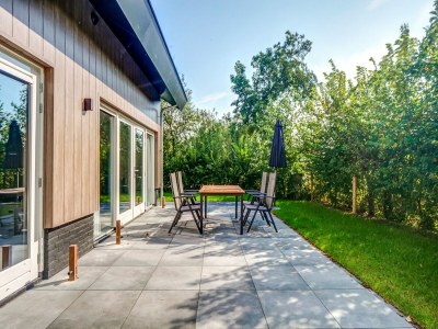 Holiday house Modern holiday home on Dutch coast with garden - Outdoor photo 3