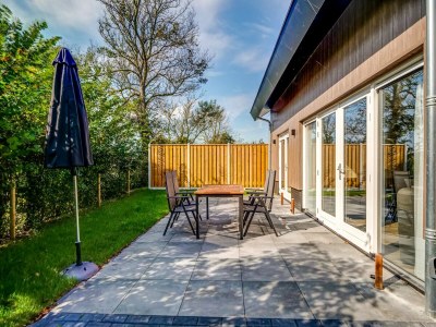 Holiday house Modern holiday home on Dutch coast with garden - Outdoor photo 5