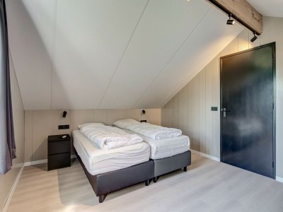 Holiday house Modern holiday home on Dutch coast with garden - Features photo 10