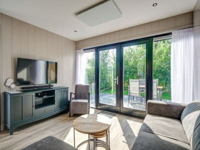 Holiday house Modern holiday home on Dutch coast with garden - Features photo 16