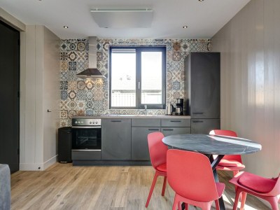 Holiday house Modern holiday home on Dutch coast with garden - Features photo 20