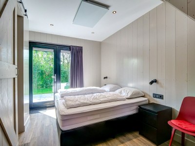 Holiday house Modern holiday home on Dutch coast with garden - Features photo 25