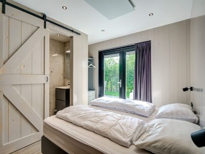 Holiday house Modern holiday home on Dutch coast with garden - Features photo 28