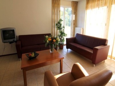 Holiday house Charming forest house surrounded by a garden - Features photo 8