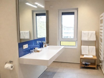 Apartment Bernsteinsee Hotel and Ferien Room with Balcony - Features photo 13